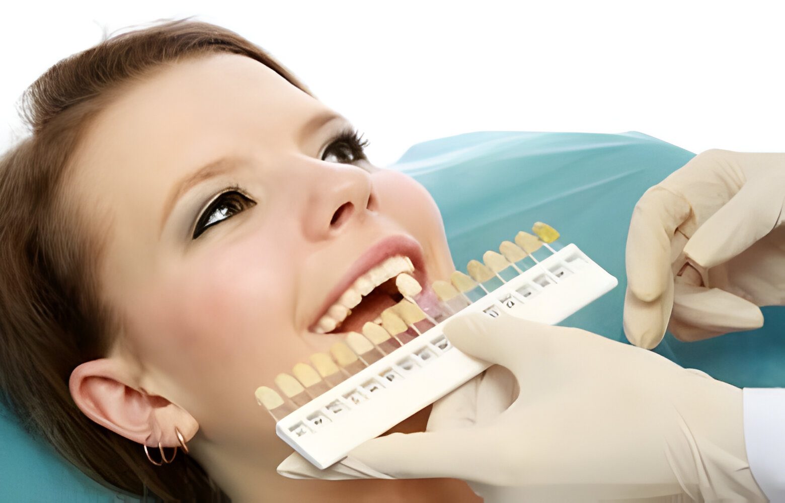 Dentist checking patient teeth color